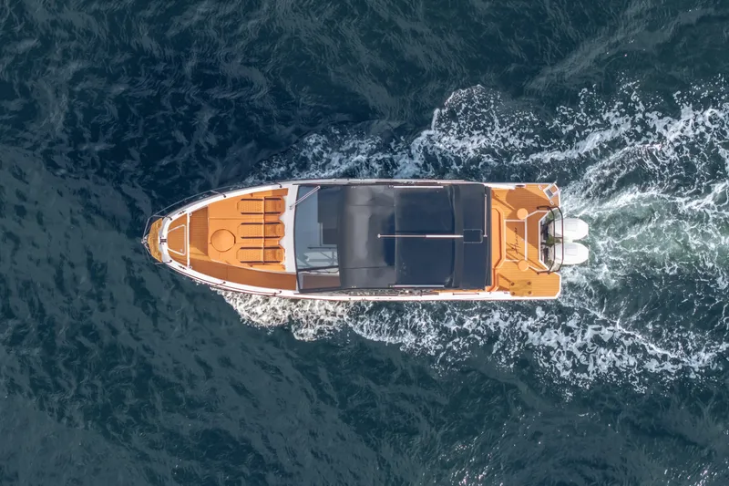 Slide: The Image of Aerial view of 2026 Hanover 387 boat cruising on open water. - 26