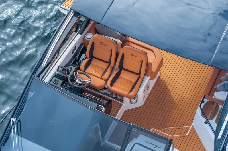 Slide: The Image of Luxurious Hanover 387 boat interior with leather seats, wooden deck, and steering wheel, 2026 model. - 28