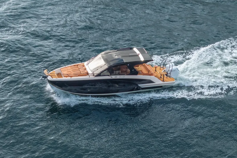 Slide: The Image of Aerial view of 2026 Hanover 387 boat cruising on open water. - 36