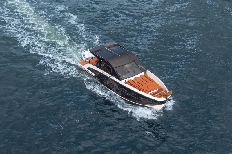 Slide: The Image of Aerial view of 2026 Hanover 387 luxury boat cruising on open water. - 37