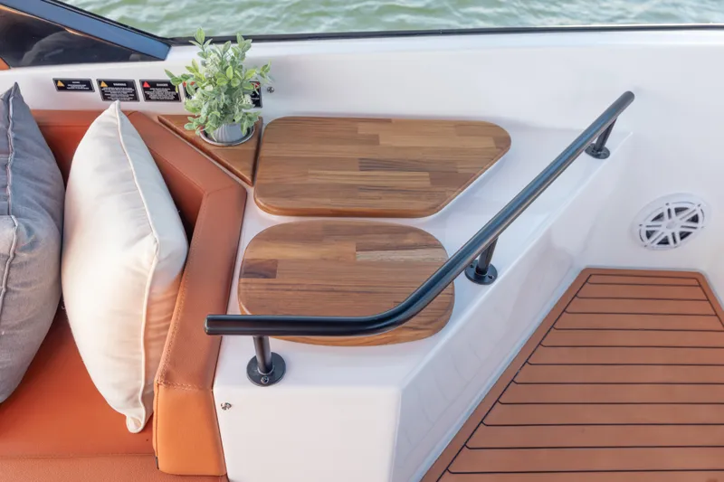 Slide: The Image of Luxurious Hanover 387 boat interior with wooden tables, cushions, and potted plant, 2026 model. - 42