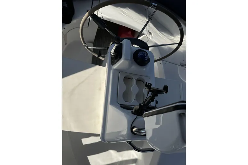 Slide: The Image of Cockpit of 1999 Hunter 340 sailboat with steering wheel and navigation instruments. - 10
