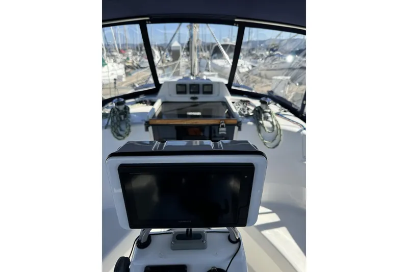 Slide: The Image of Cockpit view of a 1999 Hunter 340 sailboat with navigation equipment. - 11