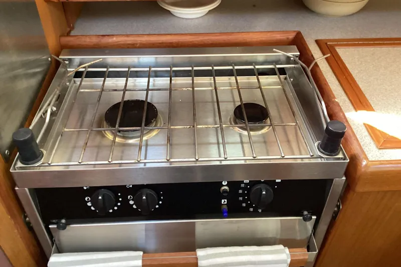 Slide: The Image of Stainless steel stove in 1999 Hunter 340 yacht kitchen, featuring two burners and control knobs. - 17