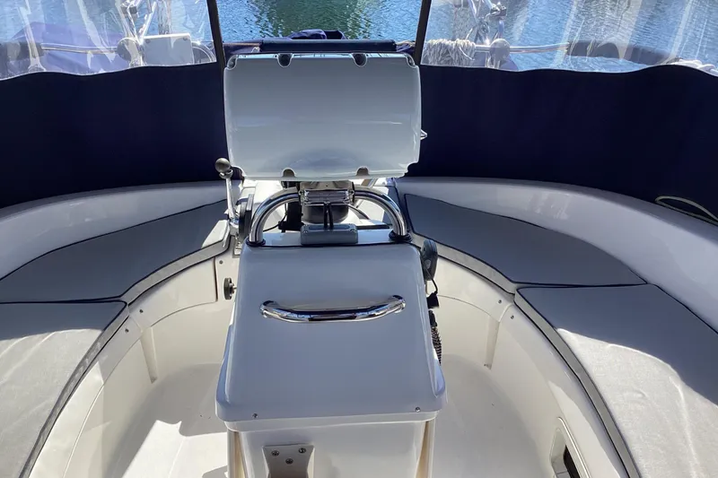 Slide: The Image of Cockpit of a 1999 Hunter 340 sailboat with seating and steering wheel. - 7