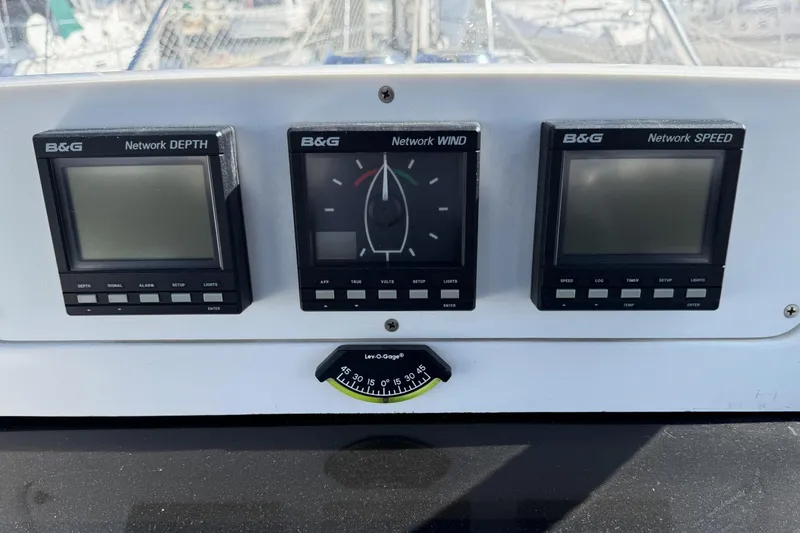 Slide: The Image of B&G marine instruments on a 1999 Hunter 340 sailboat dashboard. - 8