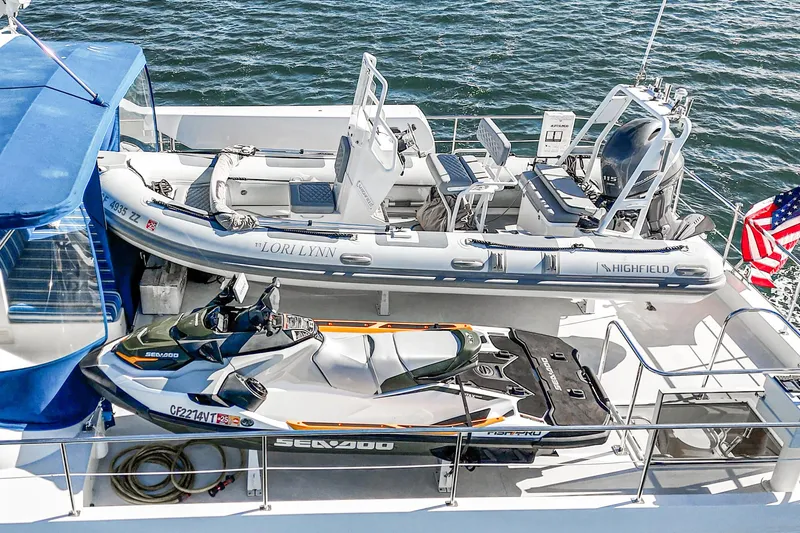 Slide: The Image of Nordlund 1995 Cockpit Motor Yacht with jet ski and inflatable boat on deck. - 11