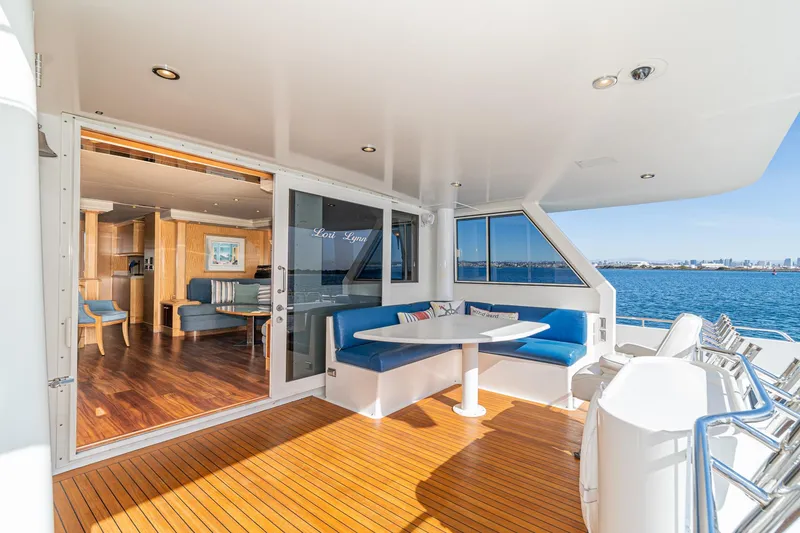 Slide: The Image of Luxurious 1995 Nordlund Cockpit Motor Yacht with elegant outdoor seating and ocean view. - 27