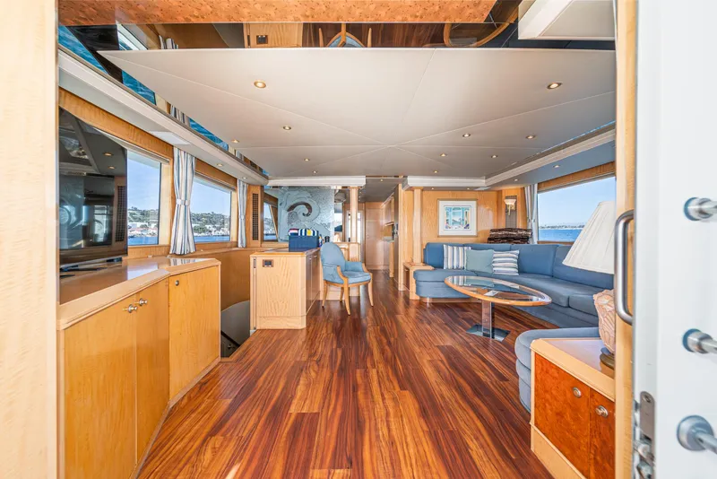Slide: The Image of Luxurious interior of 1995 Nordlund Cockpit Motor Yacht with elegant wood flooring and modern furnishings. - 28