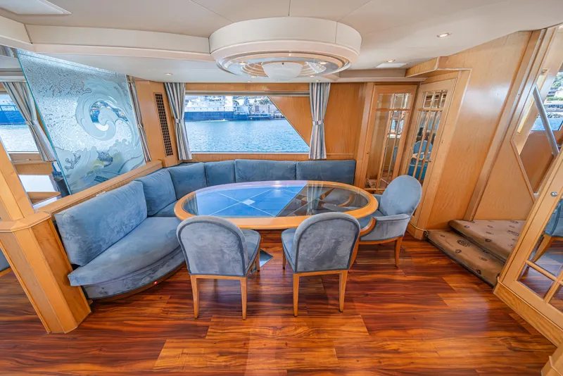 Slide: The Image of Luxurious 1995 Nordlund Cockpit Motor Yacht interior with elegant dining area and waterfront view. - 31
