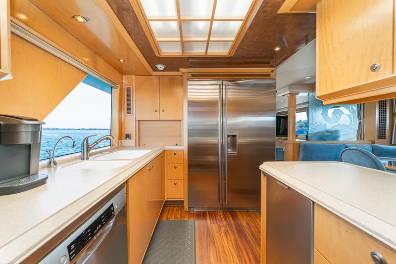 Slide: The Image of Luxurious kitchen interior of a 1995 Nordlund Cockpit Motor Yacht with modern appliances. - 34