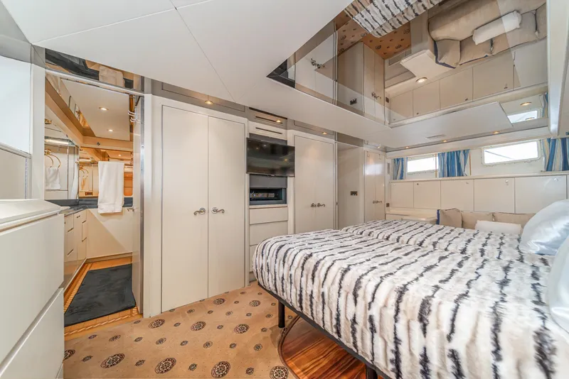 Slide: The Image of Luxurious bedroom in 1995 Nordlund Cockpit Motor Yacht with modern decor and cozy bedding. - 39