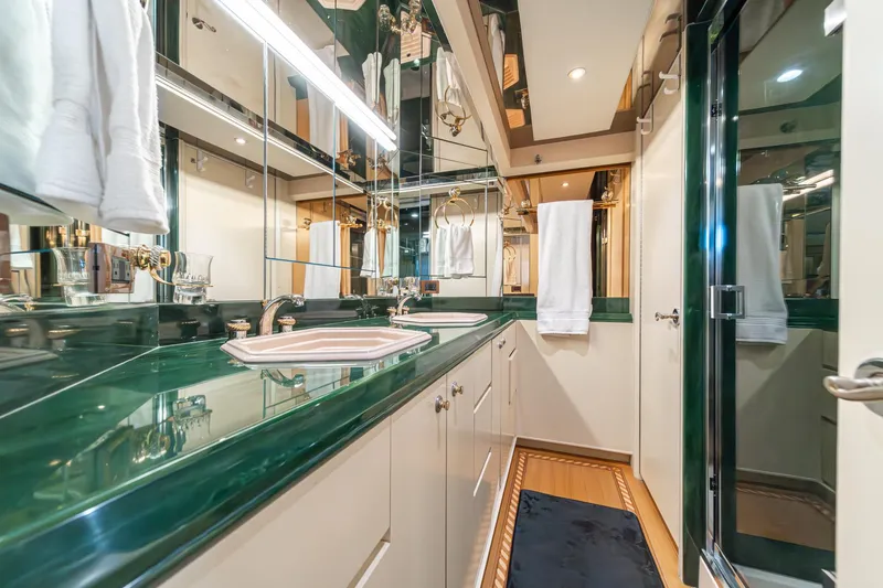 Slide: The Image of Luxurious bathroom in 1995 Nordlund Cockpit Motor Yacht with green countertops and elegant fixtures. - 40