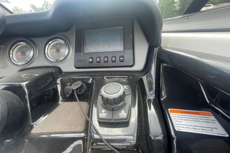 Slide: The Image of Dashboard of a 2015 Yamaha Boats 242 Limited S with controls and gauges. - 14