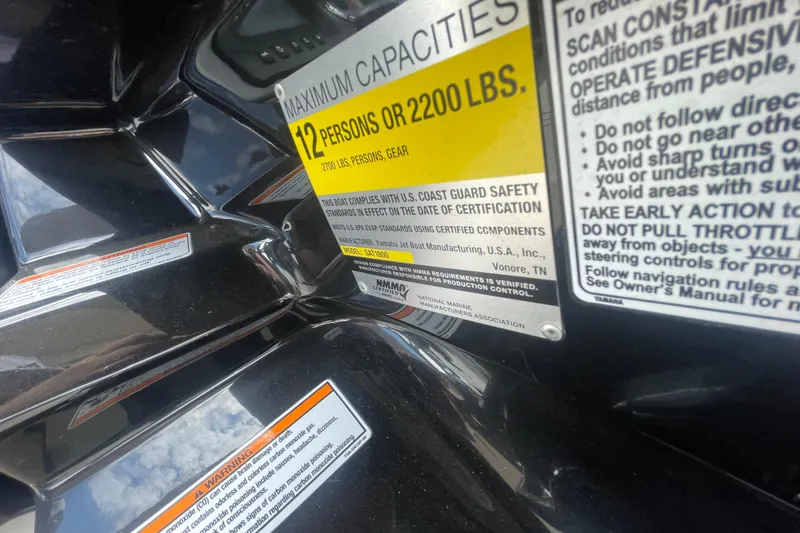 Slide: The Image of 2015 Yamaha Boats 242 Limited S capacity and safety warning labels. - 15