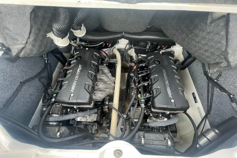 Slide: The Image of Engine compartment of a 2015 Yamaha Boats 242 Limited S, featuring dual high-output engines. - 18