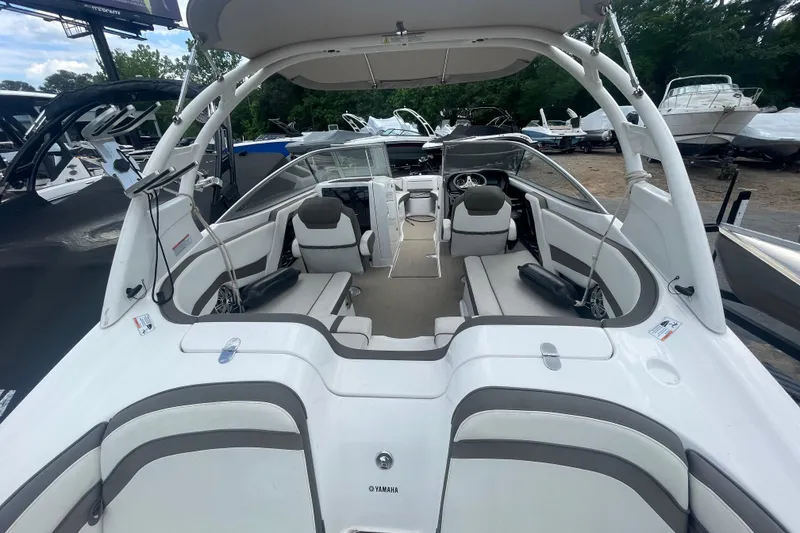 Slide: The Image of 2015 Yamaha Boats 242 Limited S interior with spacious seating and sleek design. - 23