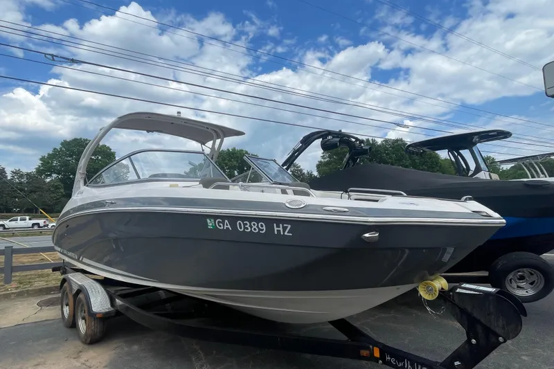 Slide: The Image of 2015 Yamaha Boats 242 Limited S on trailer under blue sky. - 28