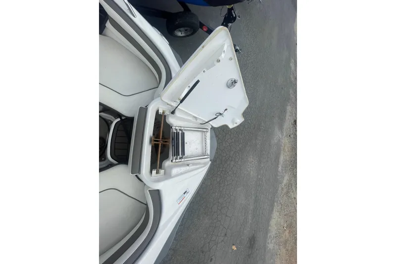 Slide: The Image of 2015 Yamaha Boats 242 Limited S with open storage compartment and ladder. - 6