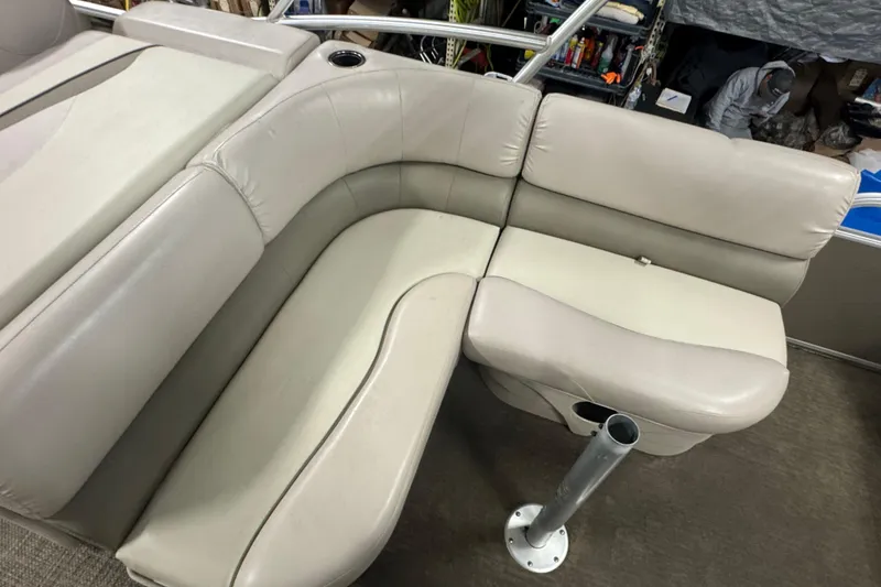 Slide: The Image of 2014 Bennington 22 SSX boat interior with beige cushioned seating and cup holder. - 10