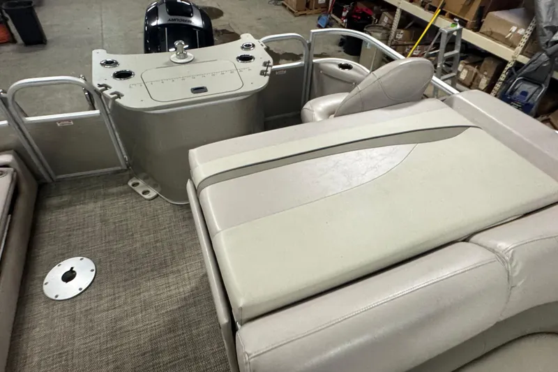 Slide: The Image of 2014 Bennington 22 SSX pontoon boat interior with seating and control panel. - 11