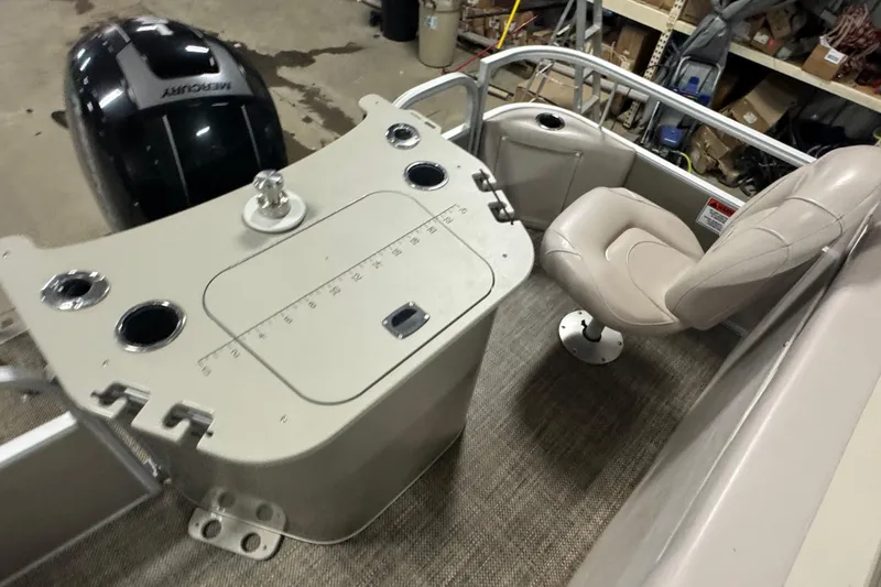 Slide: The Image of 2014 Bennington 22 SSX boat interior with seating and control panel. - 13
