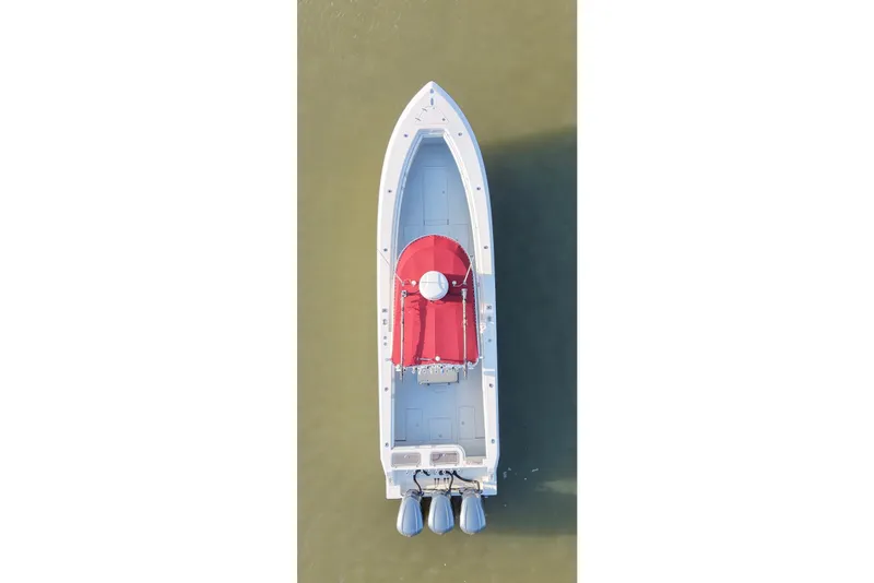 Slide: The Image of Aerial view of 2006 Contender 33 Tournament boat with red canopy on calm water. - 13