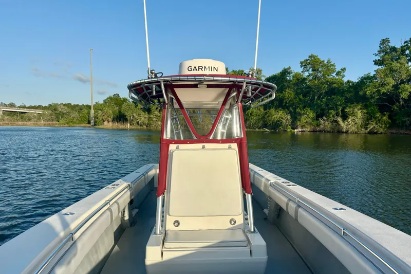 Slide: The Image of 2006 Contender 33 Tournament boat on calm water with Garmin equipment. - 17
