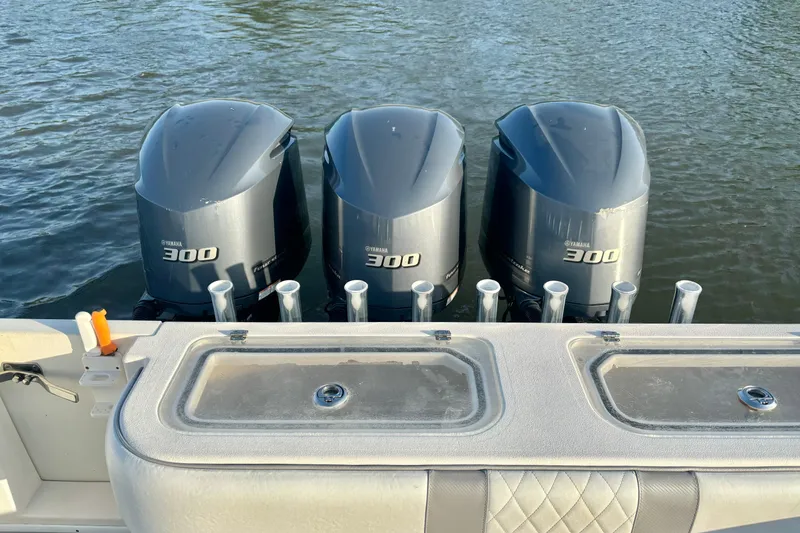 Slide: The Image of Four Yamaha 300 outboard motors on a 2006 Contender 33 Tournament boat. - 29