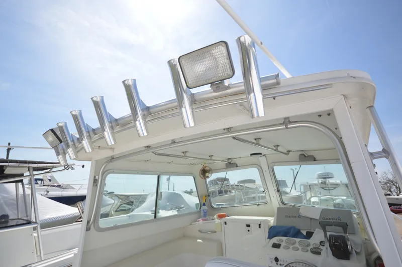 Slide: The Image of 2009 Steiger Craft 26 Miami boat cabin with rod holders and navigation equipment. - 16