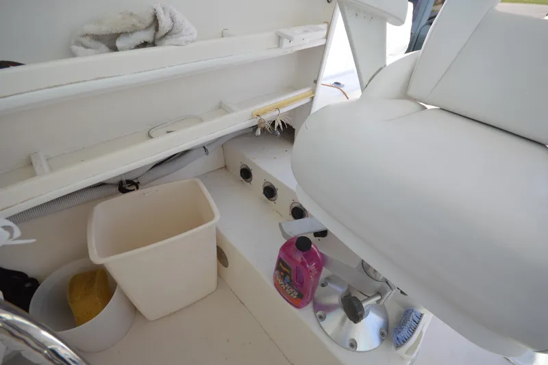 Slide: The Image of Interior of 2009 Steiger Craft 26 Miami boat with cleaning supplies and seating. - 20