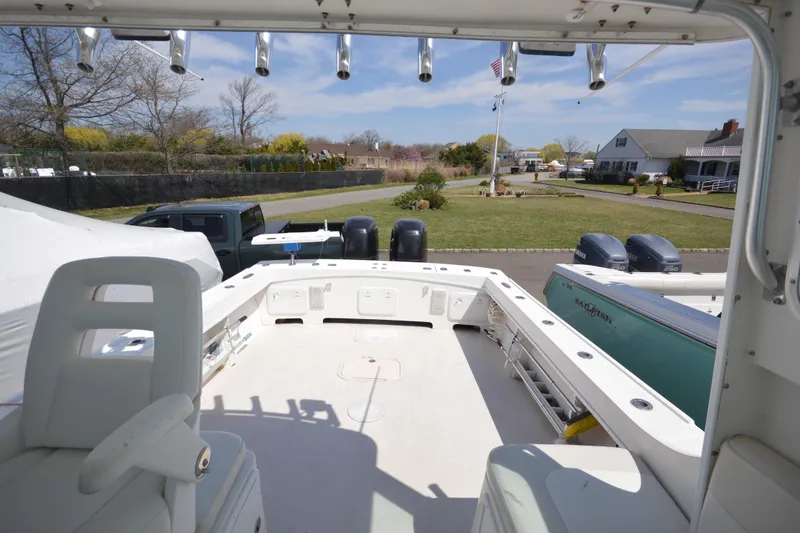 Slide: The Image of 2009 Steiger Craft 26 Miami boat with spacious deck and dual outboard motors. - 27