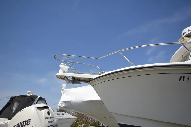 Slide: The Image of 2009 Steiger Craft 26 Miami boat with Evinrude 250 engine under clear blue sky. - 3