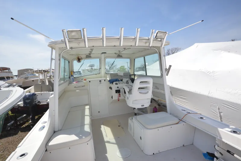 Slide: The Image of 2009 Steiger Craft 26 Miami boat interior with seating and helm station. - 8