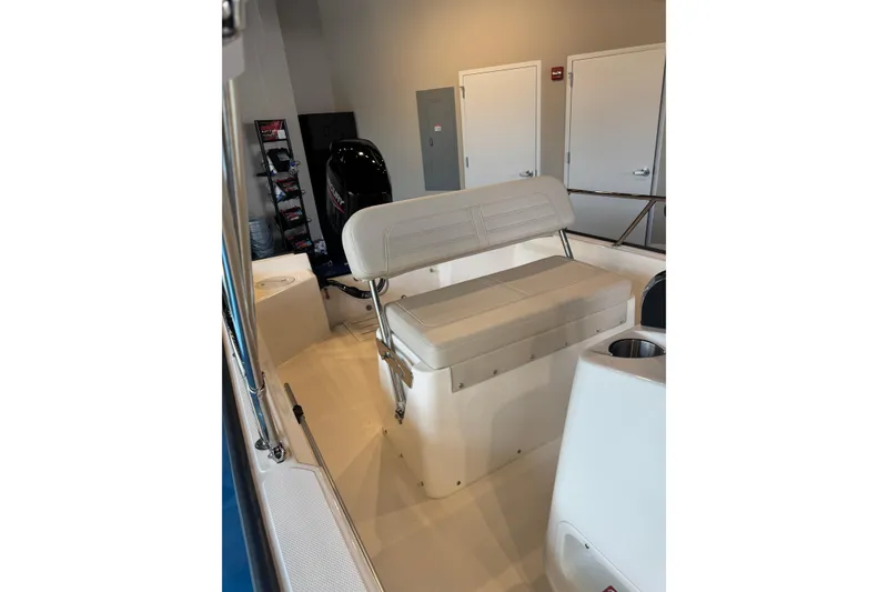 Slide: The Image of 2026 Boston Whaler 150 Montauk interior with seating and storage compartments. - 3