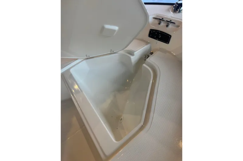 Slide: The Image of Open storage compartment on 2026 Boston Whaler 150 Montauk boat. - 5