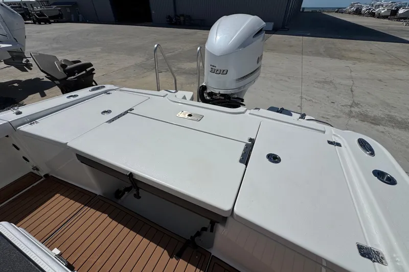 Slide: The Image of 2020 Crevalle 24 HCO boat with Yamaha 300 outboard motor, docked on concrete surface. - 11