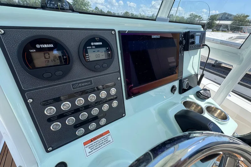 Slide: The Image of Control panel of 2020 Crevalle 24 HCO boat with Yamaha gauges and Simrad display. - 17