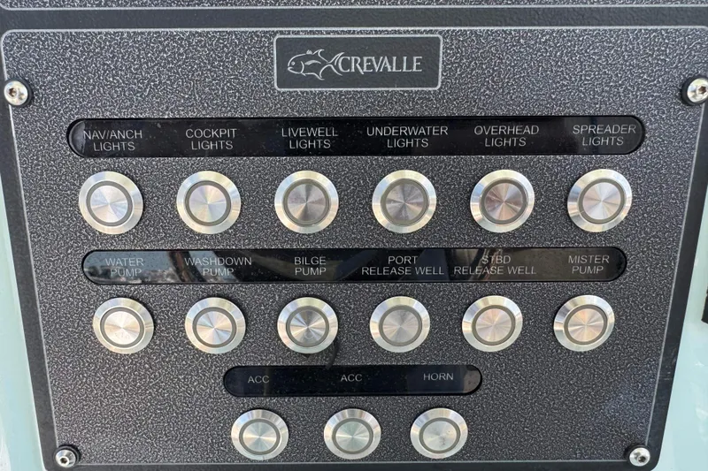 Slide: The Image of Control panel of a 2020 Crevalle 24 HCO boat with labeled buttons for various functions. - 19