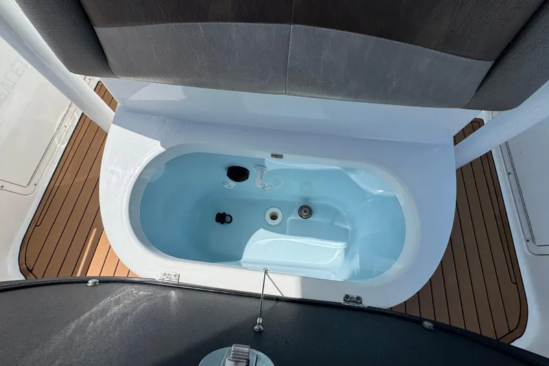 Slide: The Image of Livewell on 2020 Crevalle 24 HCO boat with teak flooring. - 23