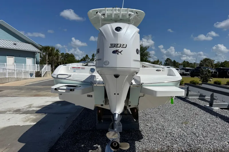 Slide: The Image of 2020 Crevalle 24 HCO boat with Yamaha 300 engine, parked outdoors. - 4