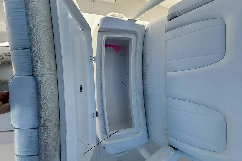 Slide: The Image of 2017 Regulator 31 boat seat with open storage compartment. - 20