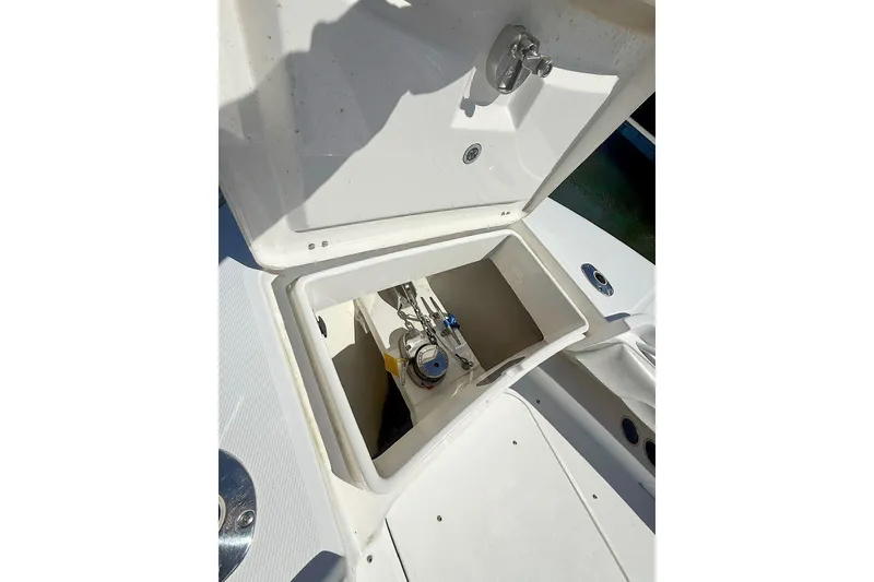 Slide: The Image of Open storage compartment on 2017 Regulator 31 boat, showcasing interior details. - 23