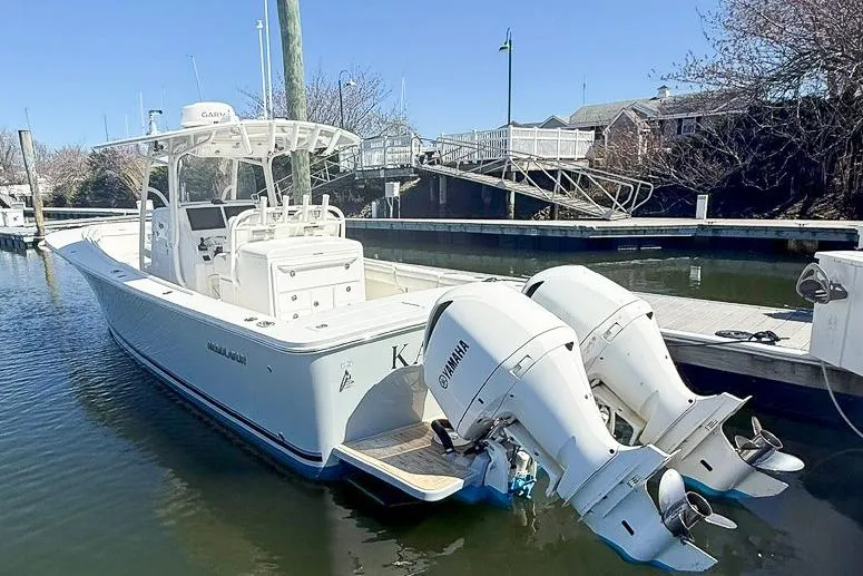 Slide: The Image of 2017 Regulator 31 boat docked with twin Yamaha outboard engines. - 3