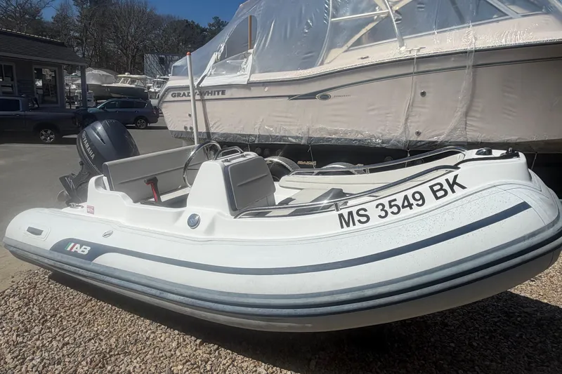 The Image of 2018 AB Inflatables Nautilus 12 DLX boat with Yamaha engine, parked outdoors. - 0