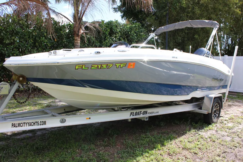 The Image of 2022 NauticStar 203 SC boat on trailer outdoors. - 0