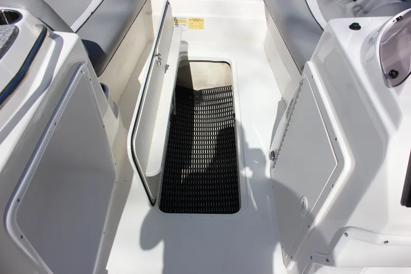 Slide: The Image of Interior of 2022 NauticStar 203 SC with storage compartment. - 20