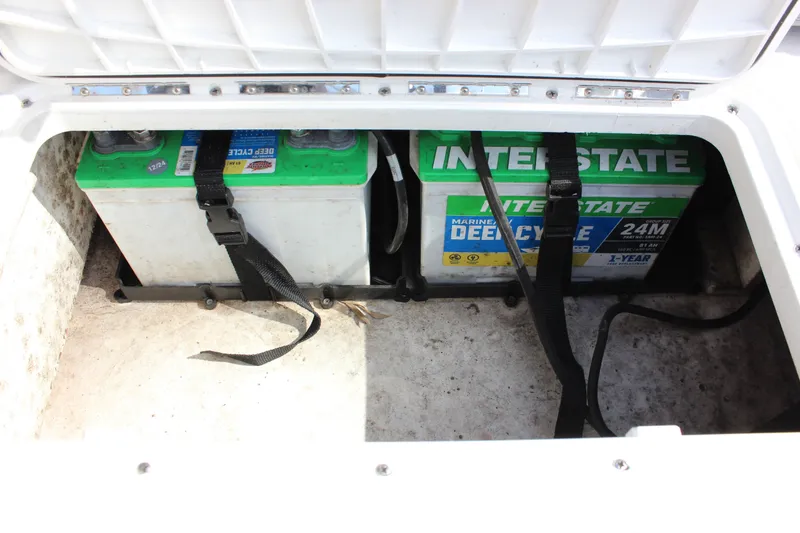 Slide: The Image of Battery compartment of 2022 NauticStar 203 SC with two deep-cycle batteries. - 25