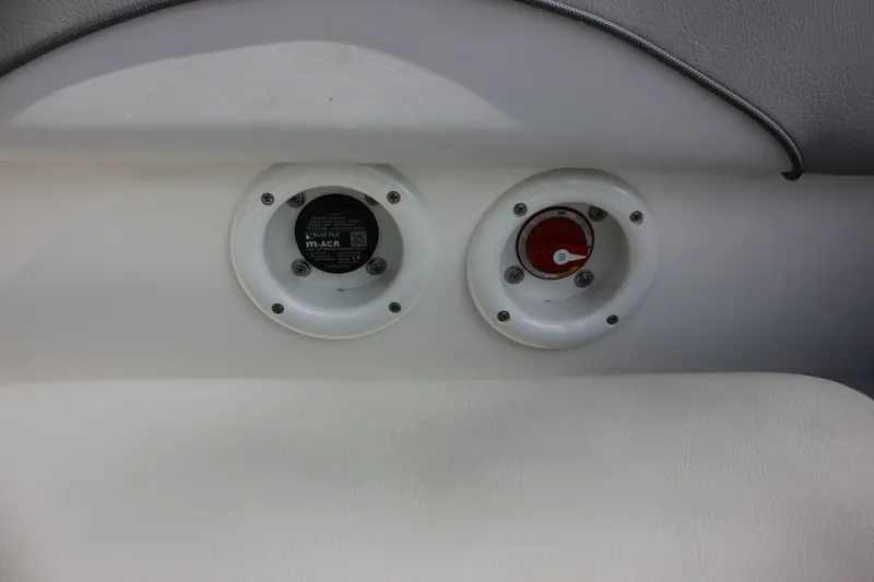 Slide: The Image of NauticStar 203 SC 2022 boat switch and socket detail view. - 26