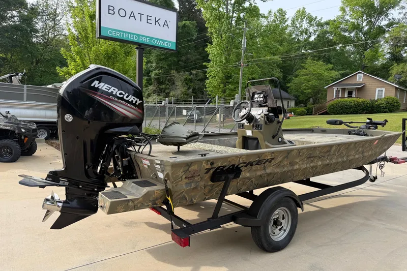 Slide: The Image of 2019 Tracker Grizzly 1860 CC Sportsman boat with Mercury engine at Boateka dealership. - 2